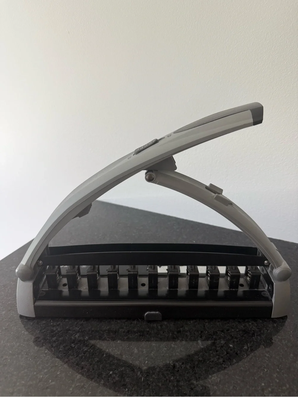 Staples Arc desktop paper punch in Gray and Black